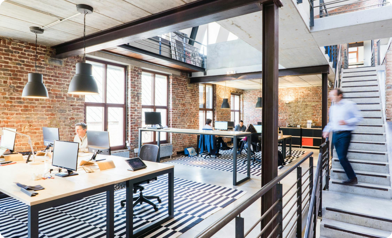 Image of an office containing people